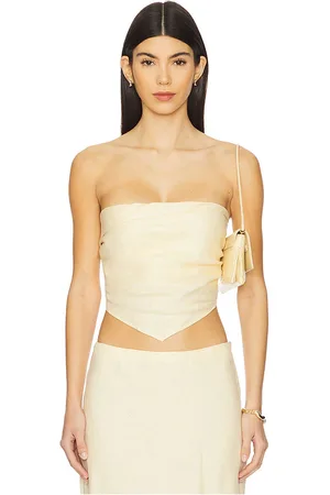 FAITHFULL THE BRAND X REVOLVE Antibes Strapless Top in - Lemon. Size L (also in XL, XS).