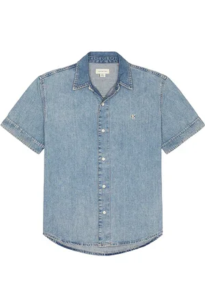 Calvin Klein Light Denim Shirt in - Blue. Size L (also in M, S, XL/1X).