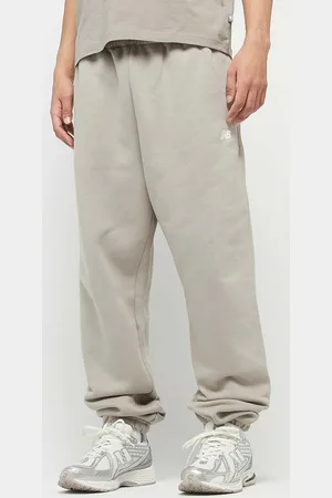 New Balance Sport Essentials Fleece Jogger homem Calças de treino bege tamanho XL Vestuário