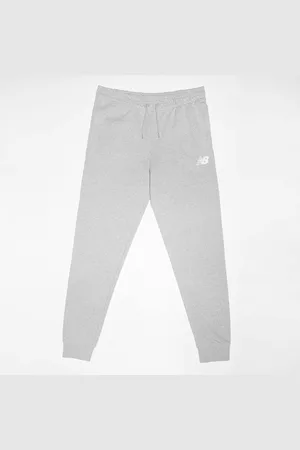 New Balance French Terry Stacked Logo Jogger unissexo Calças de treino cinzento tamanho 140 Vestuário