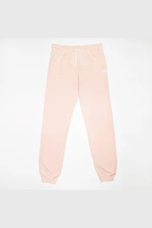 New Balance French Terry Small Logo Jogger unissexo Calças de treino rosa tamanho 158 Vestuário