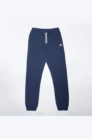 New Balance French Terry Small Logo Jogger unissexo Calças de treino azul tamanho 134 Vestuário