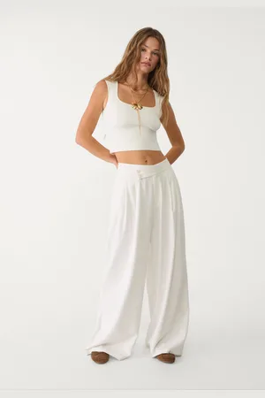 Stradivarius Calças fluidas pinças com linho 42