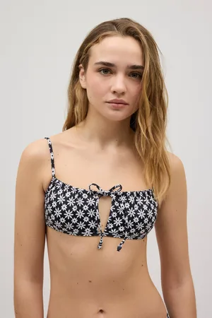YSABEL MORA Top de biquíni com detalhe de laço de flor preto e branco